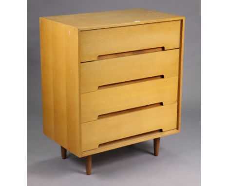 A Stagg light-oak small chest fitted four long drawers, &amp; on short round tapered legs, 30” wide x 36” high x 18” deep.
