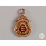 9ct gold and enamel West Lancashire Football League medal, 1922-23.
