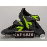 Roy Keane pair of black and yellow Diadora match worn football boots, c.2000.