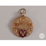9ct gold and enamel West Lancashire Football League medal.