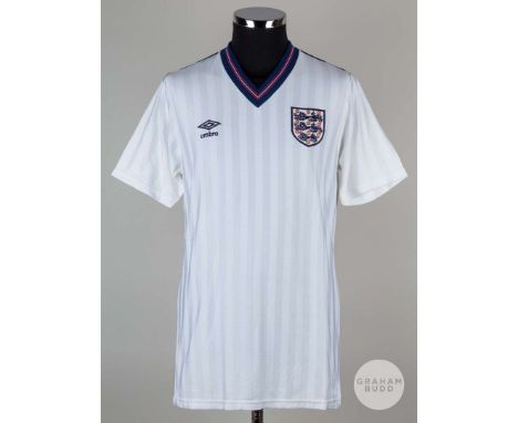 Viv Anderson white No.12 England match issued short-sleeved shirt, 1986, Mens, with v-neck collar and embroidered three lion 