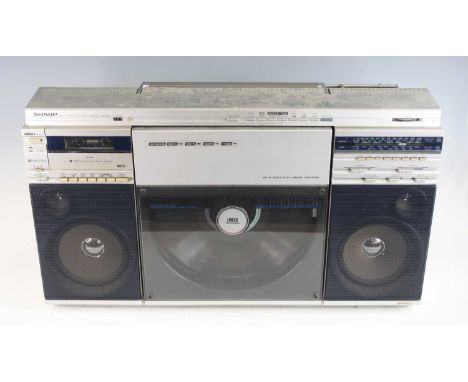 A Sharp VZ-2500 Boombox, circa 1982, having a linear tracking turntable, cassette player and FM tuner, serial no. 20803865, w