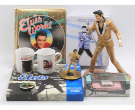 A large collection of Elvis Presley memorabilia to include a Rock 'N' Roll clock, I Can't Help Falling In Love resin figure, 