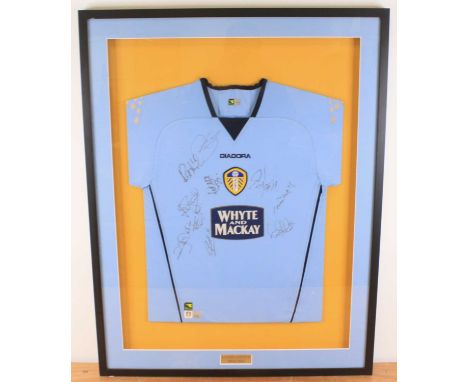 Football, a multi signed Leeds United shirt from the 2004-2005 season, mounted for display, 72 x 94cm.