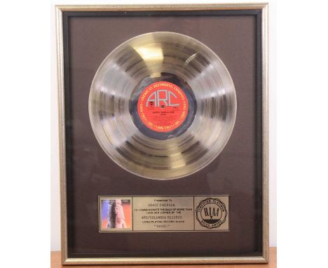 Earth, Wind &amp; Fire, Raise!, ARC AL 37548, a silver presentation disc with plaque below "Presented To Grace Emerson to com