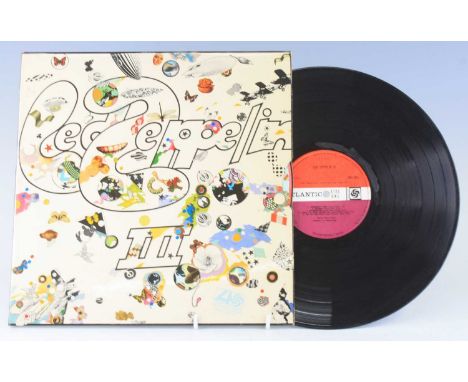 Led Zeppelin, Led Zeppelin III Atlantic 241-002 red/plum labels A/5/B5 in gate-fold wheel sleeve, together with one other exa