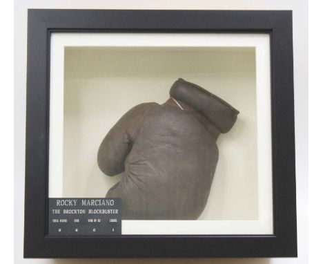 A Slazenger left handed brown leather boxing glove, mounted for display with plaque below "Rocky Marciano The Brockton Blockb