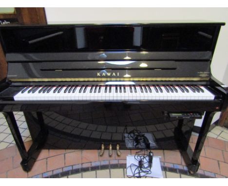 Kawai (c2011)A Model K-2 ATX upright piano in a bright ebonised case fitted with a Silent System;  together with an adjustabl