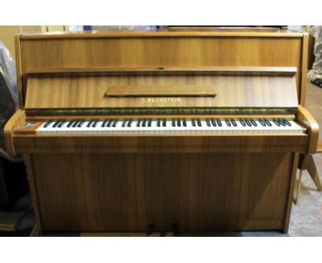 Bechstein (c1969)A Model 12N upright piano in a satin walnut case; together with a stool.