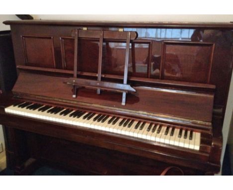 Steinway (c1915)A Vertegrand upright piano in a rosewood case; together with a stool.  This piano was the property of the jaz
