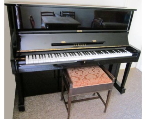 Yamaha (c1979)A Model U1 upright piano in a  bright ebonised case; together with a stool. 