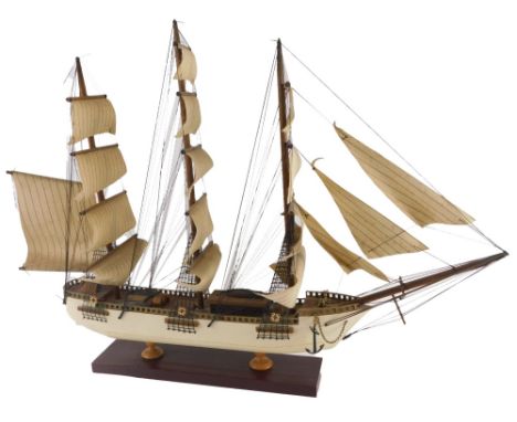 A scale model of a four masted sailing ship, with cream painted hull and rectangular base, 69cm wide. 