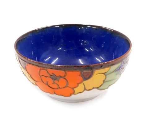 A Royal Doulton stoneware bowl, and decoration of flowers on light blue ground, 15cm diameter. 