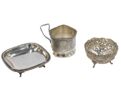 A silver plated rectangular pin dish, on tripod base with reeded border, a Continental white metal pierced design basket stam