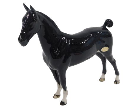 A Beswick black glazed CH Black Magic horse, bearing label. 