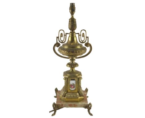 A Continental gilt metal and marble table lamp, of urn form with porcelain mounts, printed with figures, 60cm high. 