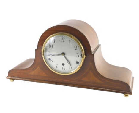 An Edwardian mahogany Napoleon's hat shaped mantel clock, with rosewood and boxwood inlay, Westminster chime, on brass bun fe