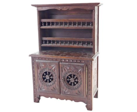 A 20thC French country made miniature dresser, the raised back with two shelves with spindle turned gallery, the base with tw