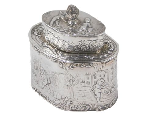 A Victorian silver tea caddy, with high relief decoration of children in town scene, an acorn finial top, maker ELM, London 1