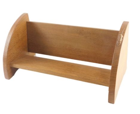 A Robert Mouseman Thompson oak book stand, with two rounded ends, one carved with a mouse, 45cm wide. 