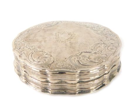 A late 19thC silver pill box, of circular form with engine turned decoration of scrolls with vacant cartouche, on a fluted bo