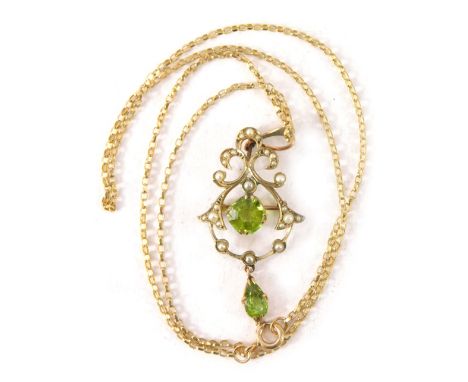 An Edwardian style pendant and chain, the arched pendant set with peridot and seed pearl, with a brooch back and pendant moun