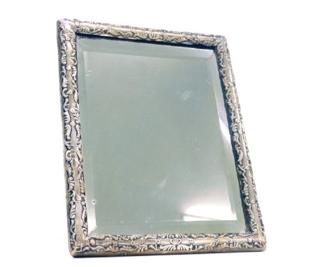 A Victorian silver mounted embossed decorated bevelled edge easel mirror, Birmingham 1900, 27.5cm x 18cm. 