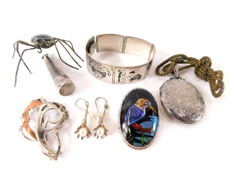 A group of silver and other costume jewellery, comprising a butterfly wind and silver eagle brooch, a Victorian silver locket