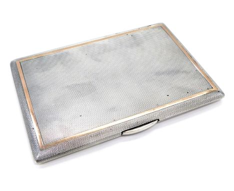 A George VI silver cigarette case, yellow gold banded engine turn design, with gilt interior, London 1950, 7oz all in.
