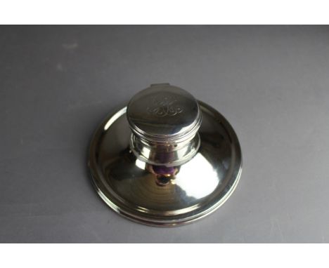 A George V silver Capstan inkwell by William Hutton & Sons, with engraved cover, 15cm diameter x 6cm high, Birmingham 1917, g