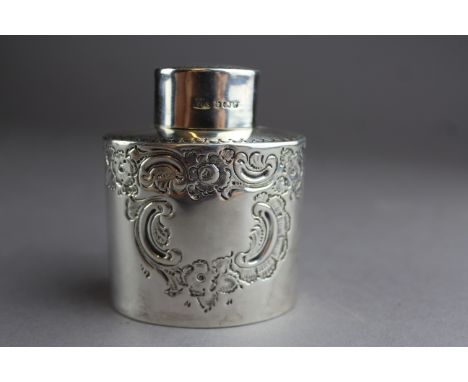 A late Victorian silver oval tea caddy by Henry Atkin, with floral ornament and open cartouche, 6cm x 4.5cm x 7.5cm high, She