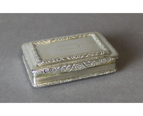 A William IV silver table snuff box by Edward Smith, with leaf and scroll mounts, reeded sides, the silver gilt interior with