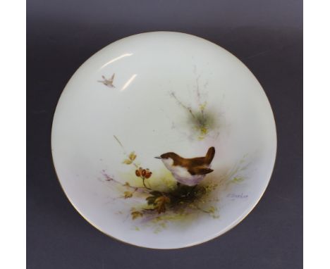 A Royal Worcester porcelain low comport, decorated with a Wren by Ernest Barker, 24cm diameter x 5cm high, signed, purple pri