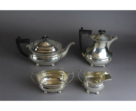 A George V silver three piece tea service by Adie Brothers, with squat bodies and gadroon mounts, comprising teapot, milk jug