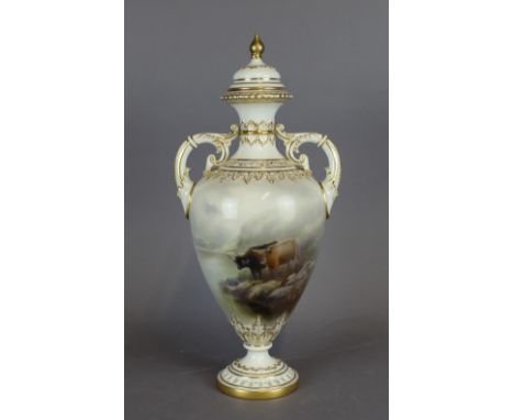 A Royal Worcester porcelain twin handled vase, decorated with cattle on a white ground, with cover for same, 33cm high, green