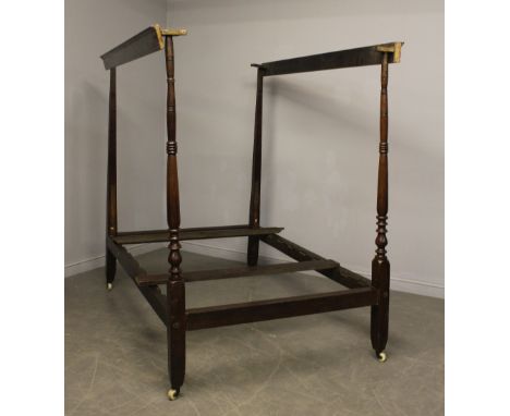A 19th Century oak 122cm four poster bed, with turned uprights, on white ceramic castors Good overall and complete