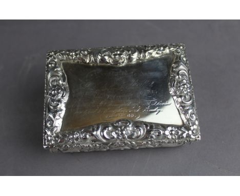 An early Victorian silver table snuff box by Neville & Ryland, boldly cast with leaf and scroll mounts, bombe sides, the top 