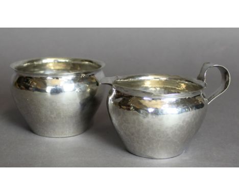 A Keswick School of Industrial Arts silver cream jug and sugar basin by Robert Temple after designs by Herbert J. Maryon, bot