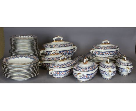 An extensive Royal Worcester Vitreous pottery dinner service, printed in blue and red and overgilded with floral ornament, wi