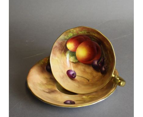 A Royal Worcester porcelain breakfast tea cup and saucer, decorated with fruit by Harry Ayrton, signed, purple printed marks 