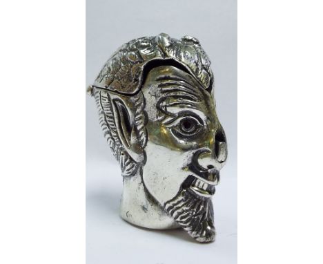 A silver metamorphic vesta case, in the form of a head

We will post this item worldwide at cost. No packing charge. 