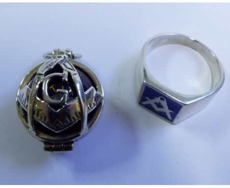 A silver and enamel masonic style ring, and a silver fob (2)

We will post this item worldwide at cost. No packing charge. 