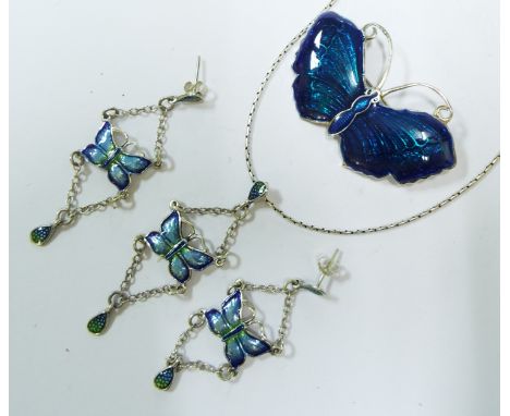 A pair of silver and enamel earrings, in the form of butterflies, a matching necklace, and a matching brooch (3)

We will pos