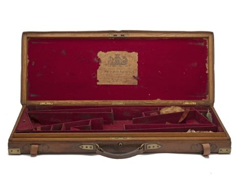EDWARD WHISTLER A BRASS-CORNERED OAK AND LEATHER DOUBLE GUNCASE, fitted for 30in. barrels, the interior lined with maroon bai