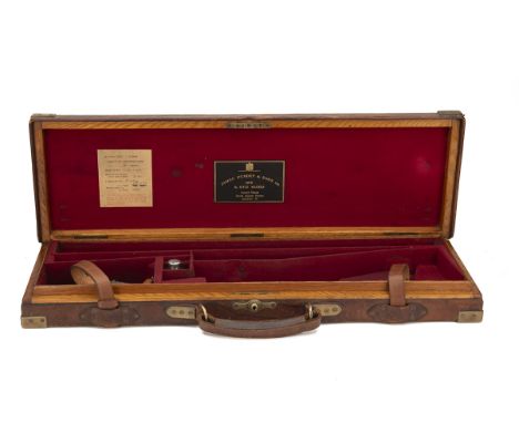 JAMES PURDEY &amp; SONS LTD. A BRASS-CORNERED OAK AND LEATHER SINGLE GUNCASE, fitted for 28in. barrels, the interior lined wi