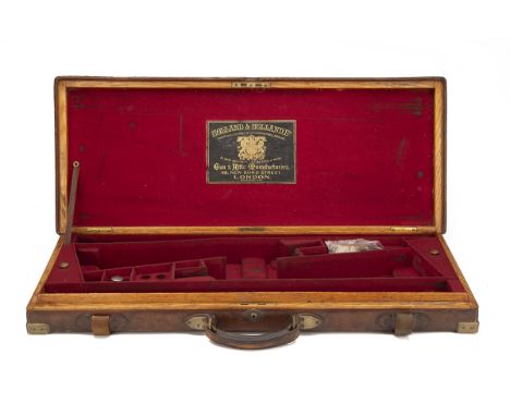 HOLLAND &amp; HOLLAND A BRASS-CORNERED OAK AND LEATHER DOUBLE GUNCASE, fitted for 30in. barrels, the interior lined with red 