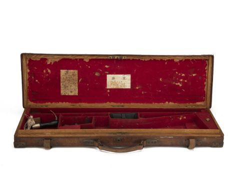 JAMES PURDEY &amp; SONS A BRASS-CORNERED OAK AND LEATHER GUNCASE, fitted for 30in. barrels, red baize-lined interior, lid wit