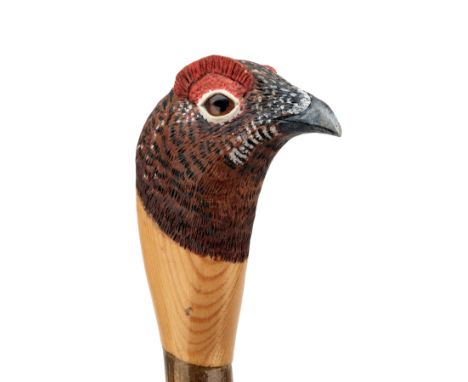 MARK RICHARDS A HAND CARVED SPORTSMAN'S STAFF, measuring approx. 51in. in length, with hardwood shaft, the top carved and pai