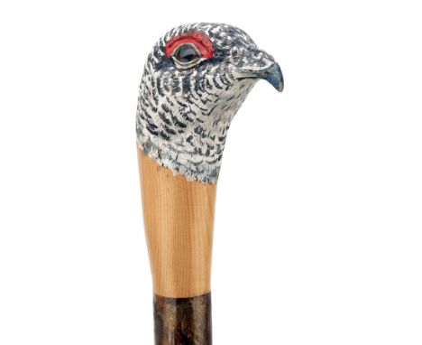 MARK RICHARDS A HAND CARVED SPORTSMAN'S STAFF, measuring approx. 51in. in length, with ashwood type shaft, the top carved in 