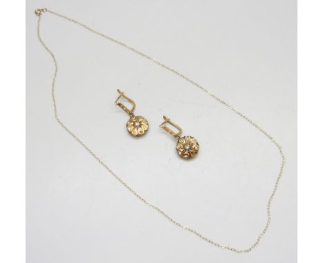 A pair of yellow metal and clear stone earrings and a 9ct gold chain 